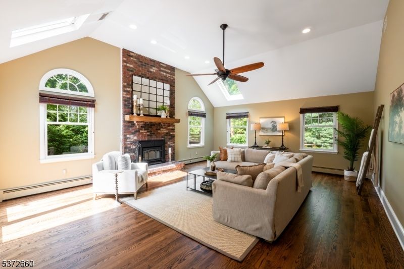 Fireplace, Interior, Living room, Recessed Lighting, Stone Walls, Wood Texture Flooring