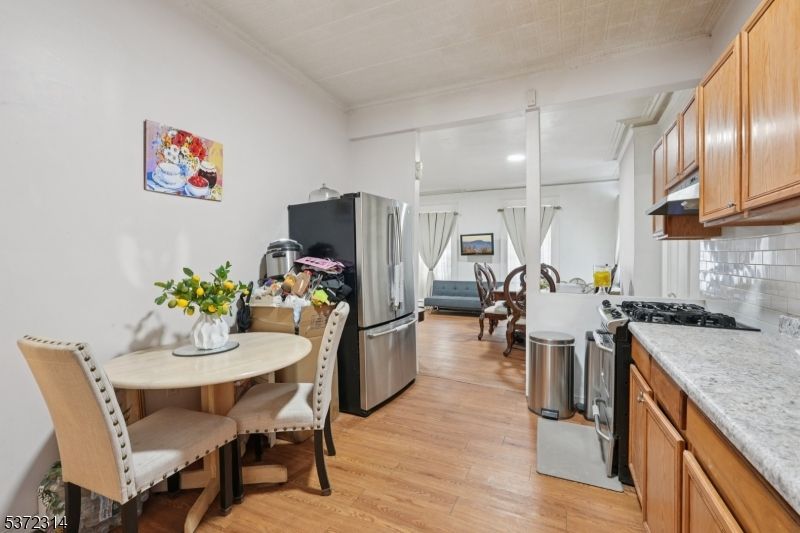 Dining room, Interior, Kitchen, Recessed Lighting, Stainless Steel Appliances, Wood Texture Flooring