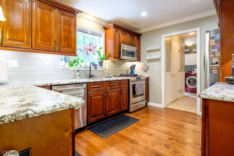 Interior, Kitchen, Recessed Lighting, Stainless Steel Appliances, Washer, Wood Texture Flooring