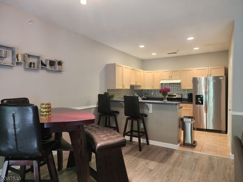 Dining room, Interior, Kitchen, Recessed Lighting, Stainless Steel Appliances, Wood Texture Flooring