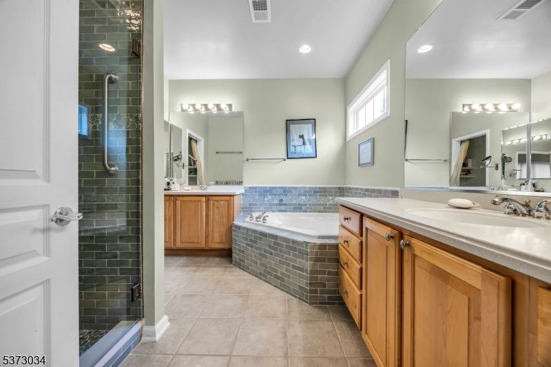 Bathroom, Dual Sink Vanities, Glass Shower, Interior, Recessed Lighting, Stone Walls