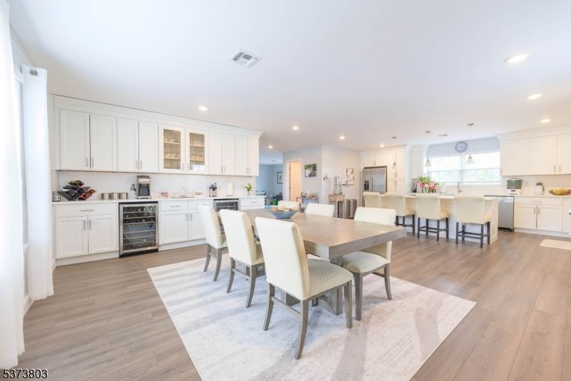Dining room, Interior, Kitchen, Recessed Lighting, Stainless Steel Appliances, Wood Texture Flooring