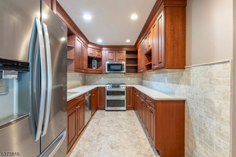 Interior, Kitchen, Recessed Lighting, Stainless Steel Appliances, Stone Walls