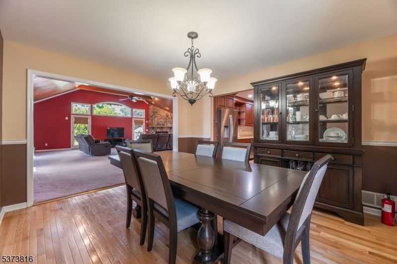 Chandelier, Dining room, Fireplace, Interior, Living room, Wood Texture Flooring