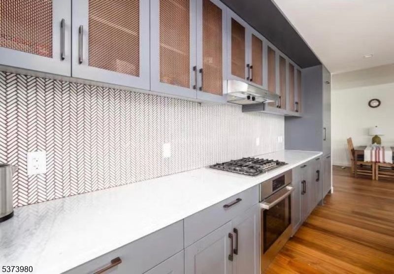 Dining room, Interior, Kitchen, Recessed Lighting, Stainless Steel Appliances, Wood Texture Flooring