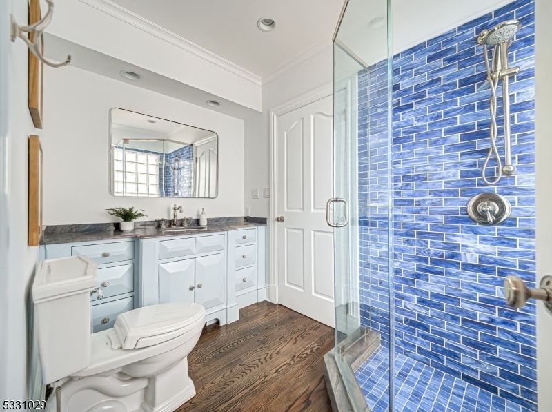 Bathroom, Glass Shower, Interior, Recessed Lighting, Tile Countertops, Wood Texture Flooring
