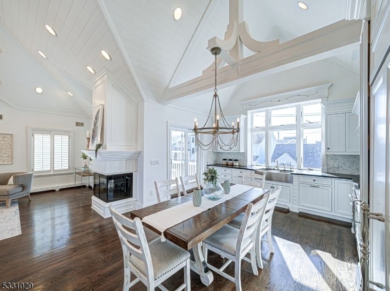 Chandelier, Dining room, Fireplace, Interior, Kitchen, Pendant Lights, Recessed Lighting, Wood Texture Flooring