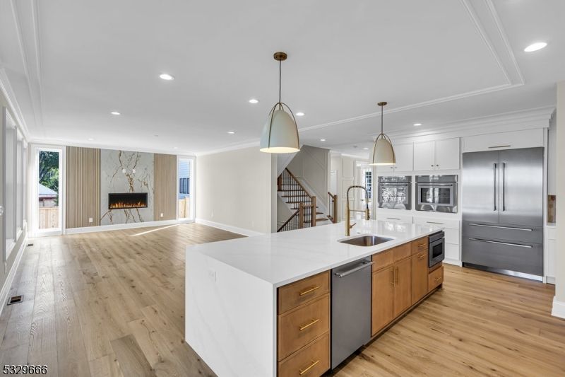 Fireplace, Interior, Kitchen, Pendant Lights, Recessed Lighting, Stainless Steel Appliances, Wood Texture Flooring