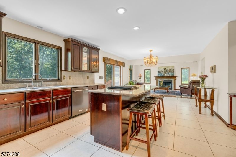 Chandelier, Fireplace, Interior, Kitchen, Living room, Recessed Lighting, Stainless Steel Appliances
