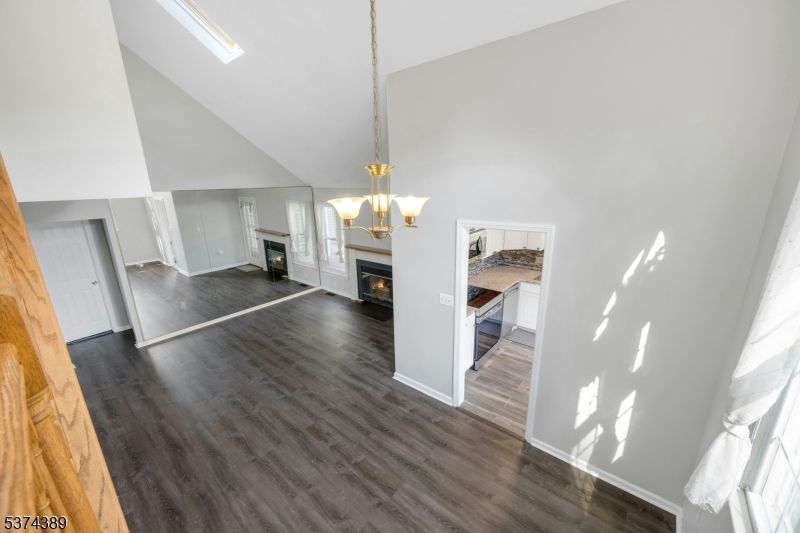 Empty room, Fireplace, Interior, Pendant Lights, Wood Texture Flooring
