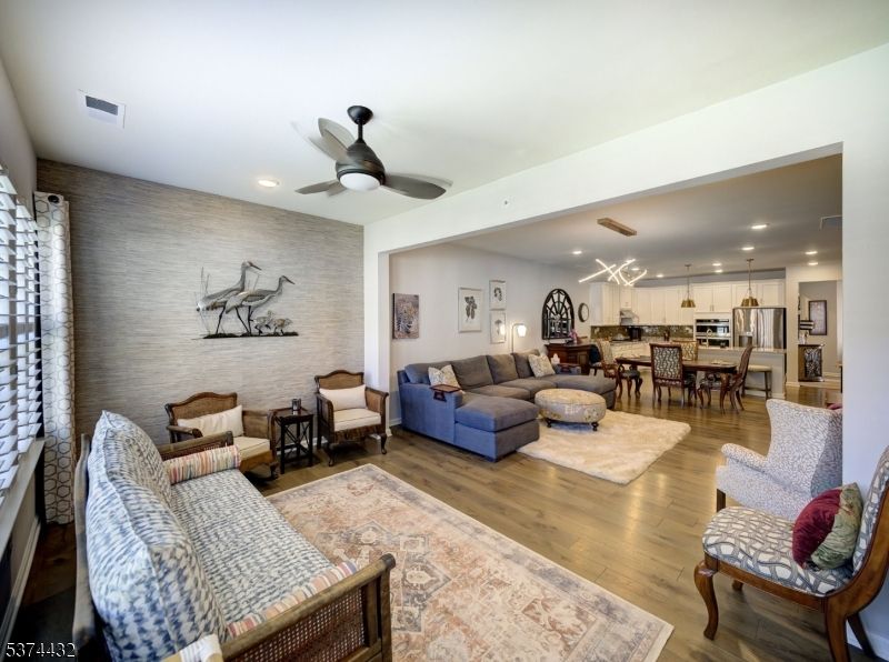 Dining room, Interior, Kitchen, Living room, Pendant Lights, Recessed Lighting, Stainless Steel Appliances, Wood Texture Flooring