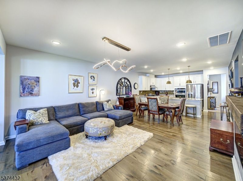 Dining room, Interior, Kitchen, Living room, Pendant Lights, Recessed Lighting, Stainless Steel Appliances, Wood Texture Flooring