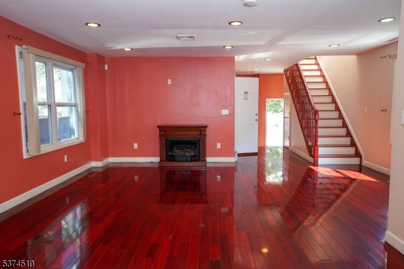 Empty room, Fireplace, Interior, Recessed Lighting, Wood Texture Flooring