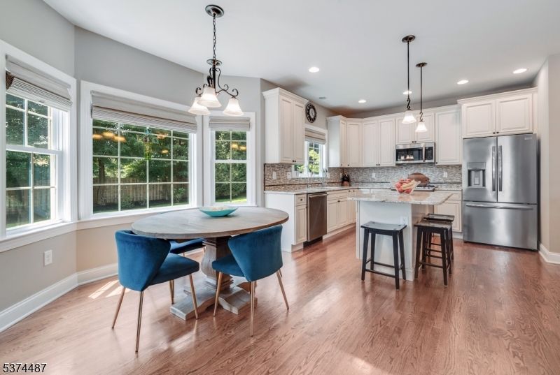 Dining room, Interior, Kitchen, Pendant Lights, Recessed Lighting, Stainless Steel Appliances, Wood Texture Flooring