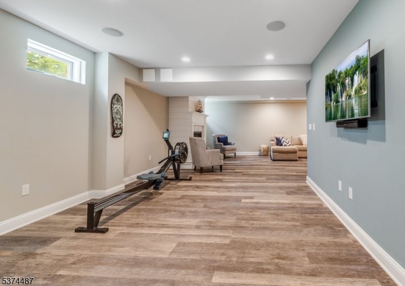 Fireplace, Fitness Equipment, Interior, Recessed Lighting, Wood Texture Flooring