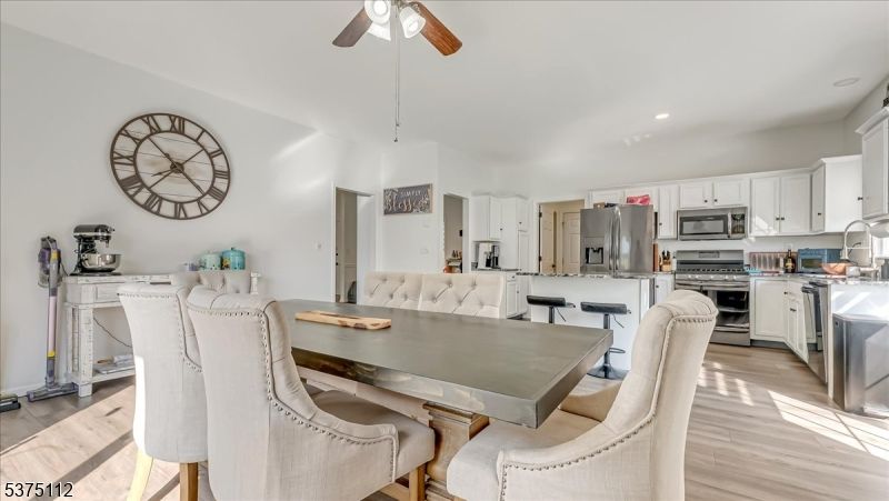 Dining room, Interior, Kitchen, Recessed Lighting, Stainless Steel Appliances, Wood Texture Flooring