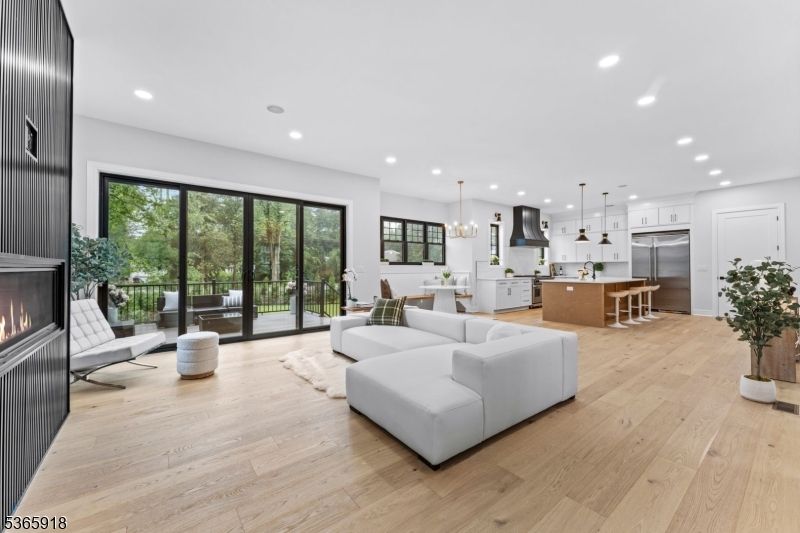 Dining room, Fireplace, Interior, Kitchen, Living room, Pendant Lights, Recessed Lighting, Stainless Steel Appliances, Wood Texture Flooring