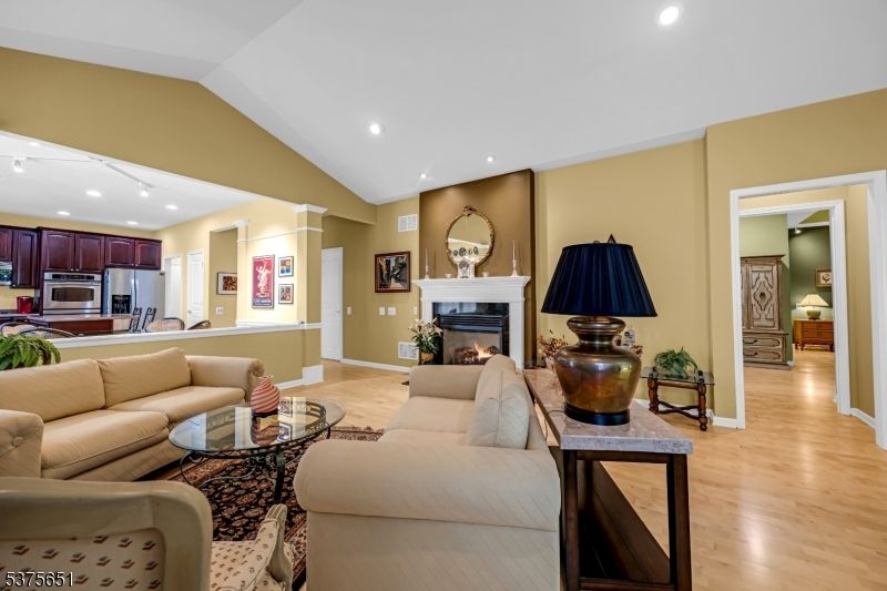 Fireplace, Interior, Kitchen, Living room, Recessed Lighting, Stainless Steel Appliances, Wood Texture Flooring