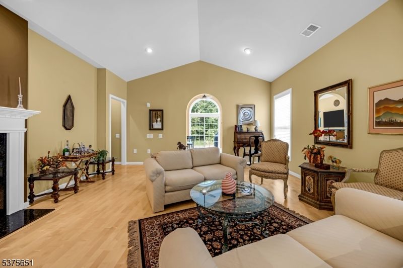Fireplace, Interior, Living room, Piano, Recessed Lighting, Wood Texture Flooring