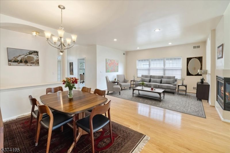 Chandelier, Dining room, Fireplace, Interior, Living room, Recessed Lighting, Wood Texture Flooring