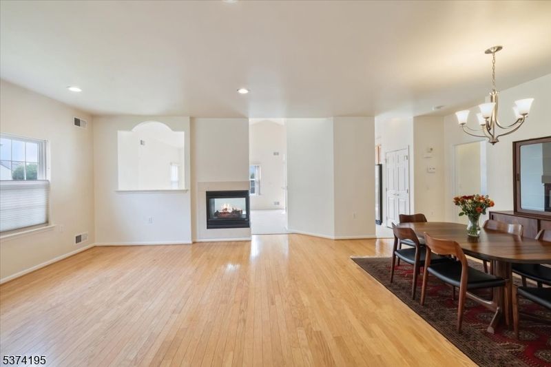 Chandelier, Dining room, Fireplace, Interior, Recessed Lighting, Wood Texture Flooring