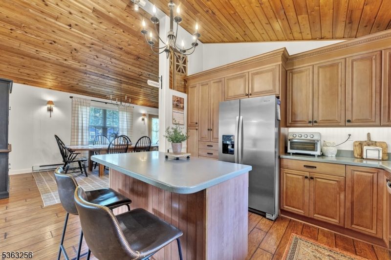 Chandelier, Dining room, Interior, Kitchen, Stainless Steel Appliances, Wooden Ceilings, Wood Texture Flooring
