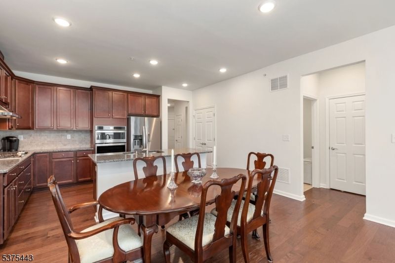 Dining room, Interior, Kitchen, Recessed Lighting, Stainless Steel Appliances, Wood Texture Flooring