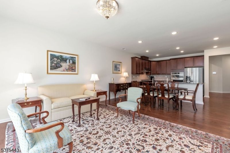 Chandelier, Dining room, Interior, Kitchen, Living room, Recessed Lighting, Stainless Steel Appliances, Wood Texture Flooring