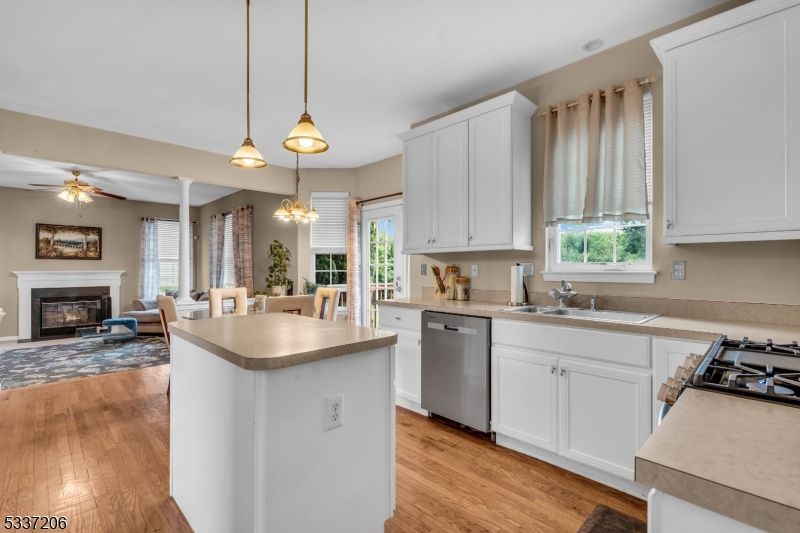 Dining room, Fireplace, Interior, Kitchen, Pendant Lights, Wood Texture Flooring