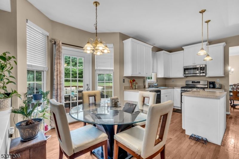 Dining room, Interior, Kitchen, Pendant Lights, Stainless Steel Appliances, Wood Texture Flooring