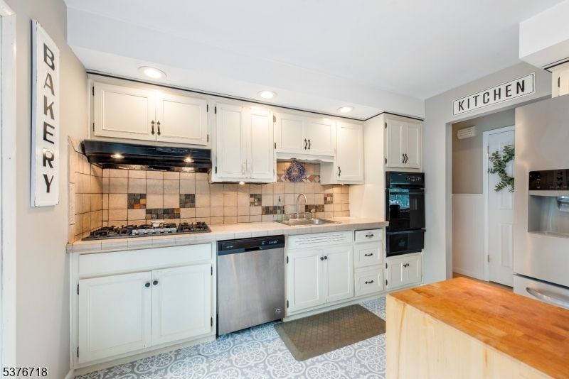 Interior, Kitchen, Recessed Lighting, Stainless Steel Appliances, Tile Countertops