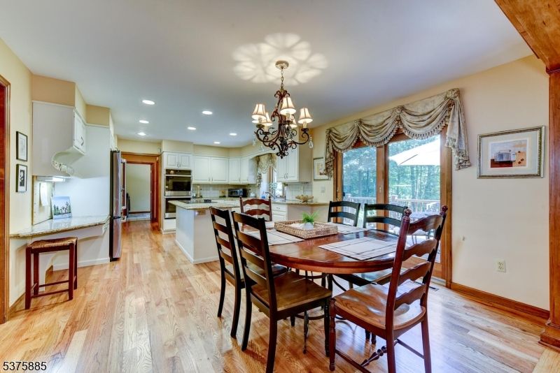 Chandelier, Dining room, Interior, Kitchen, Recessed Lighting, Stainless Steel Appliances, Wood Texture Flooring