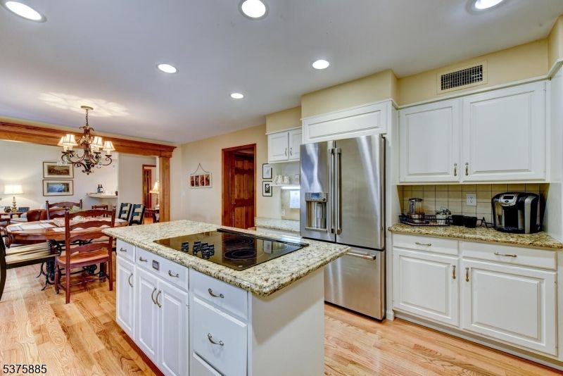 Chandelier, Dining room, Interior, Kitchen, Recessed Lighting, Stainless Steel Appliances, Wood Texture Flooring