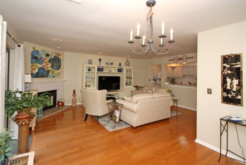 Chandelier, Fireplace, Interior, Living room, Recessed Lighting, Wood Texture Flooring