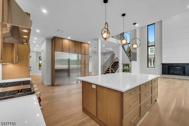 Fireplace, Interior, Kitchen, Pendant Lights, Recessed Lighting, Stainless Steel Appliances, Wood Texture Flooring
