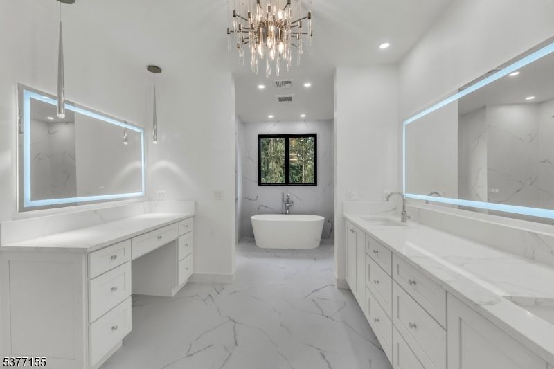 Bathroom, Chandelier, Dual Sink Vanities, Free Standing Baths, Interior, Marble, Marble Walls, Pendant Lights, Recessed Lighting