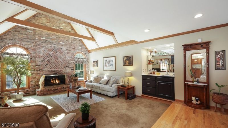 Fireplace, Interior, Living room, Recessed Lighting, Stone Walls, Wood Texture Flooring