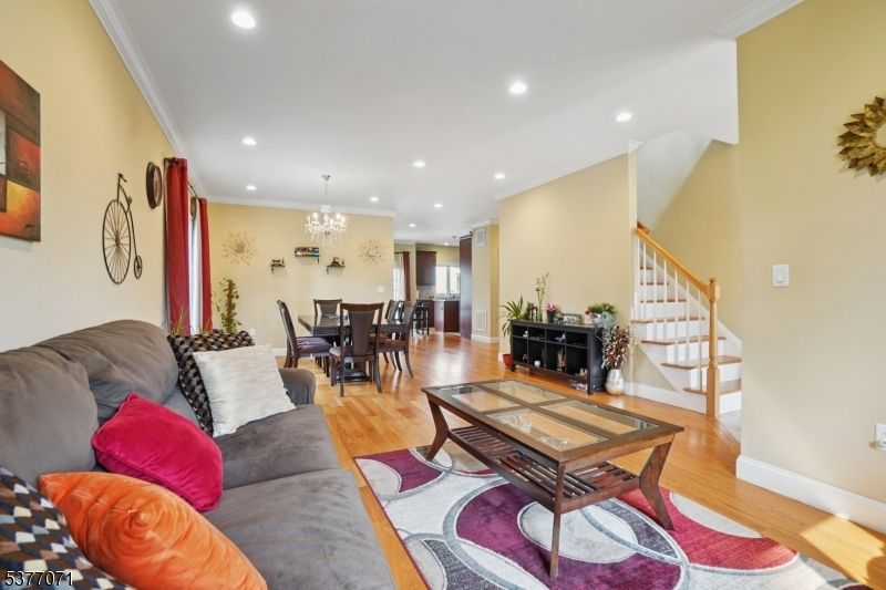 Chandelier, Dining room, Fireplace, Interior, Living room, Recessed Lighting, Wood Texture Flooring