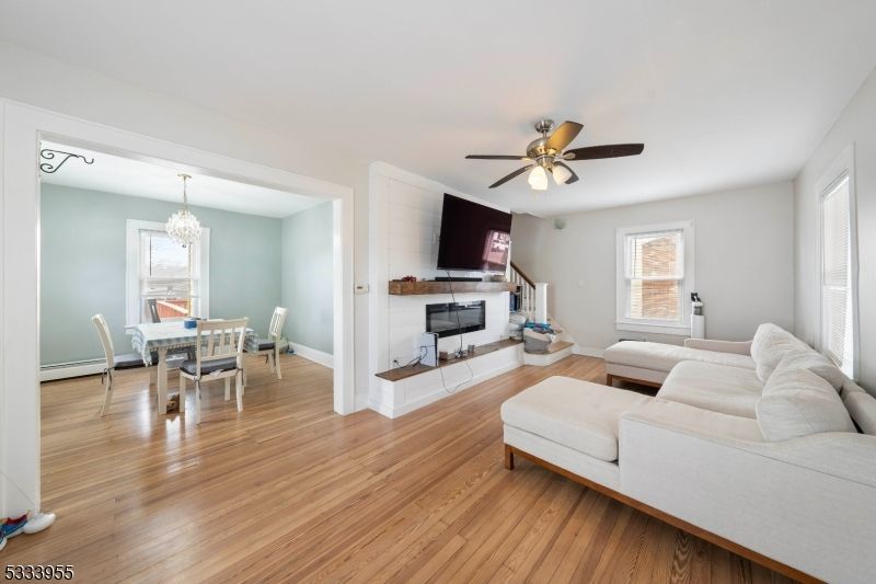 Chandelier, Dining room, Fireplace, Interior, Living room, Wood Texture Flooring
