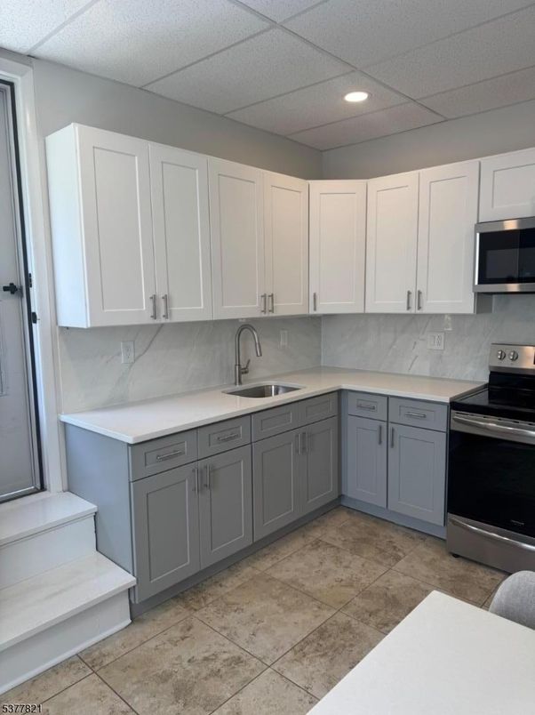 Interior, Kitchen, Marble Walls, Recessed Lighting, Stainless Steel Appliances