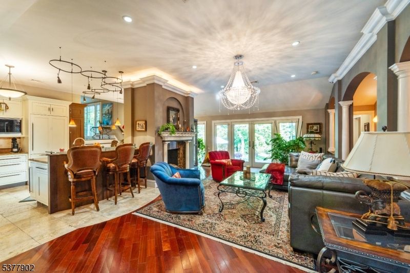 Chandelier, Dining room, Fireplace, Interior, Kitchen, Living room, Pendant Lights, Recessed Lighting, Wood Texture Flooring