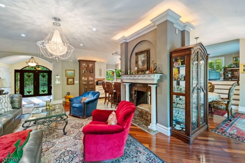 Chandelier, Fireplace, Interior, Living room, Recessed Lighting, Wood Texture Flooring