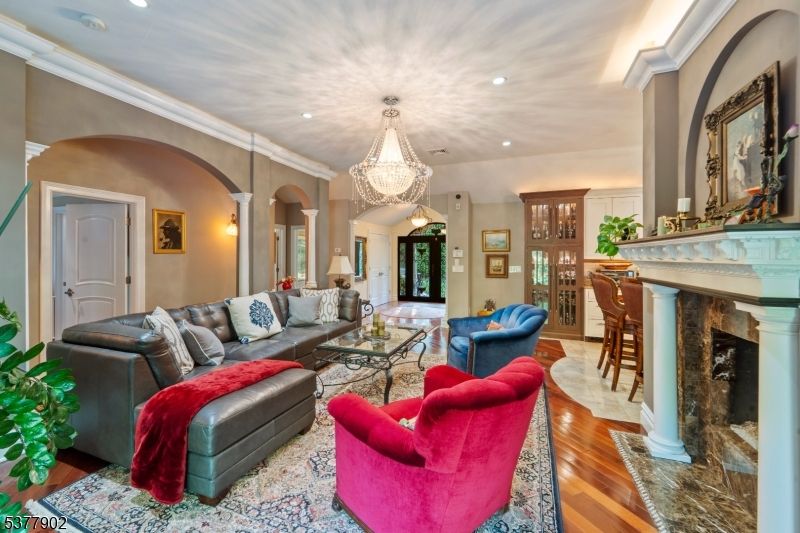 Chandelier, Fireplace, Interior, Living room, Recessed Lighting, Wood Texture Flooring