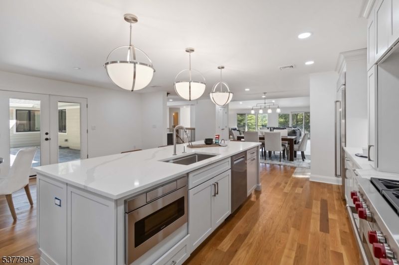 Dining room, Interior, Kitchen, Pendant Lights, Recessed Lighting, Stainless Steel Appliances, Wood Texture Flooring