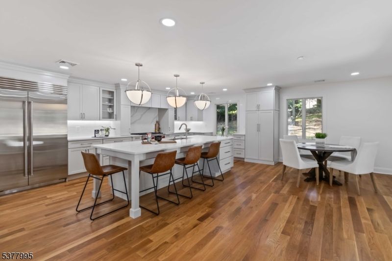 Dining room, Interior, Kitchen, Pendant Lights, Recessed Lighting, Stainless Steel Appliances, Wood Texture Flooring