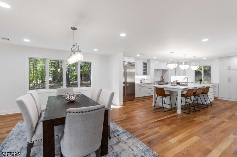 Dining room, Interior, Kitchen, Pendant Lights, Recessed Lighting, Stainless Steel Appliances, Wood Texture Flooring