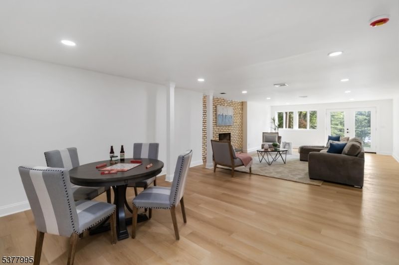 Dining room, Fireplace, Interior, Living room, Recessed Lighting, Wood Texture Flooring