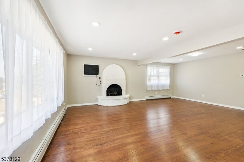 Empty room, Fireplace, Interior, Recessed Lighting, Wood Texture Flooring