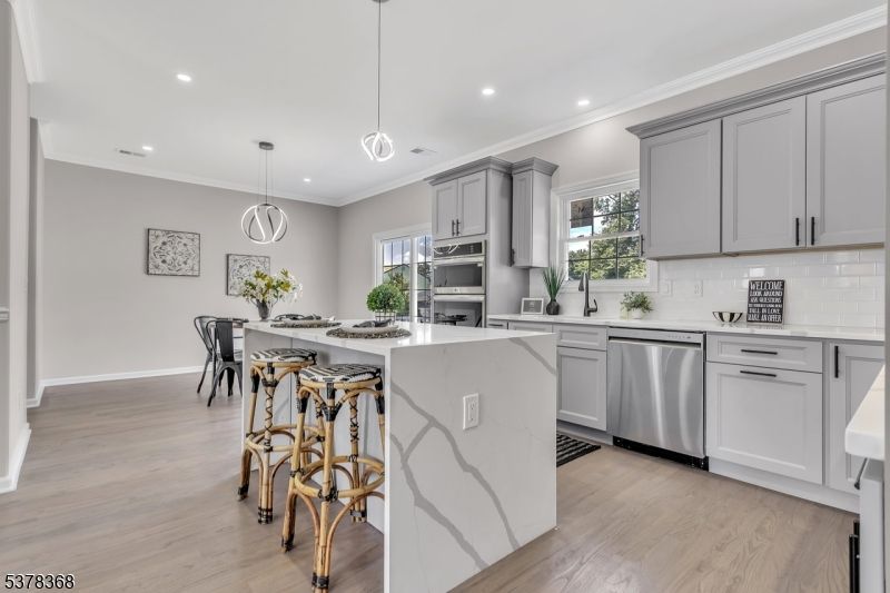 Dining room, Interior, Kitchen, Pendant Lights, Recessed Lighting, Stainless Steel Appliances, Wood Texture Flooring