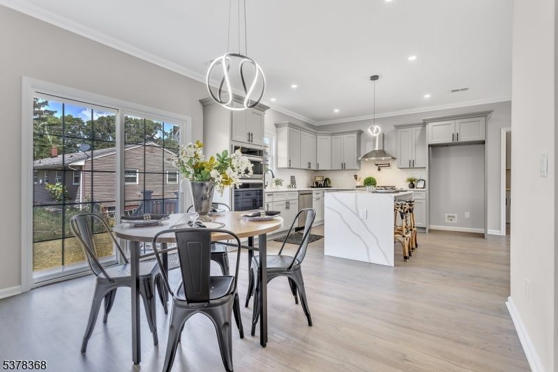 Dining room, Interior, Kitchen, Pendant Lights, Recessed Lighting, Stainless Steel Appliances, Wood Texture Flooring